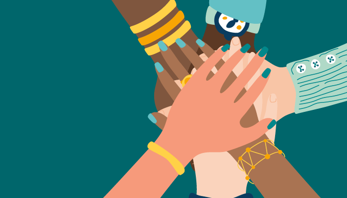 Hands of differing skin tones come together in a hand pile on a teal background.