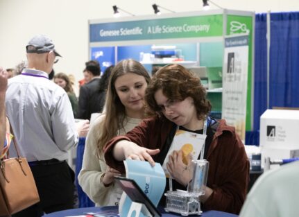 Conference attendees at exhibits.